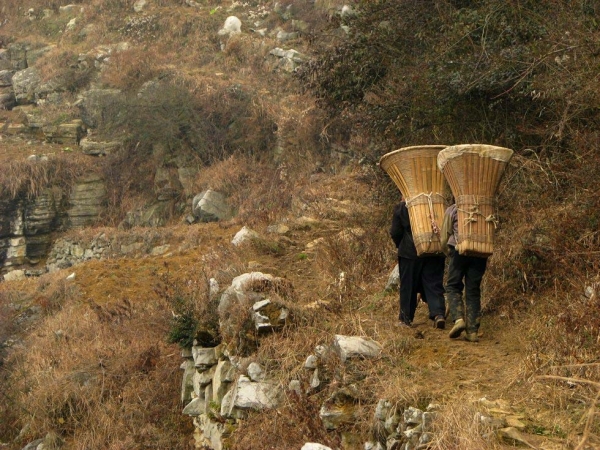 Villagers haul coal and fertilizer up the mountain. (Dan Washburn)