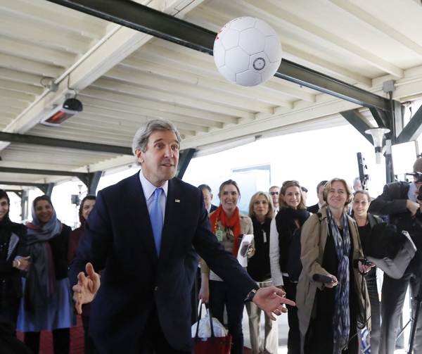 U.S. Secretary of State John Kerry heads an Afghan-made soccer ball toward the unseen captain of the Afghanistan's women's national soccer team in Kabul on March 26, 2013. (Jason Reed/AFP/Getty Images) 