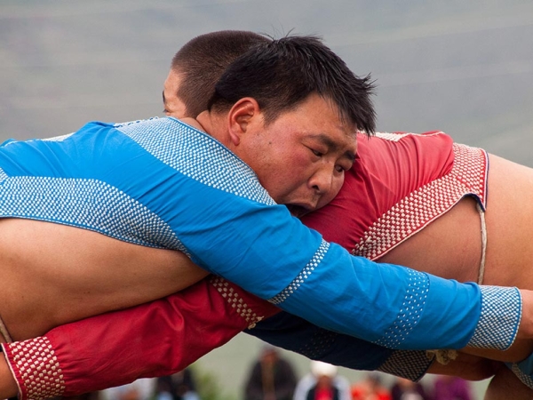 Naadam is an important Mongolian holiday celebrated every July. Wrestling competitions are among the three main sporting "games" enjoyed during this festival. (Evgeni Zotov/Flickr)