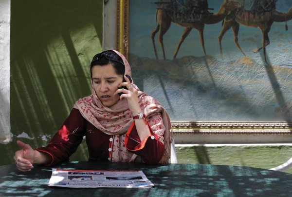 Kabul, 2010: Human rights campaigner Orzala Ashraf, working from the relative safety of the Kabul Cafe. (Abbie Traylor Smith/Panos)
