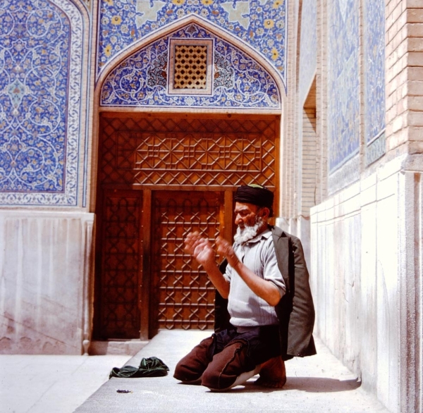 A man in the midst of his prayers.