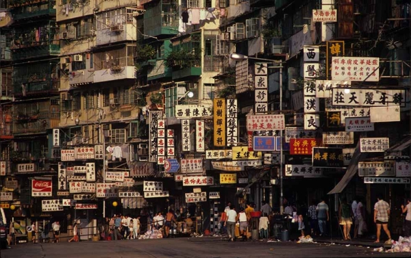 Street life was often bustling outside the Kowloon Walled City. Today, traces of the Walled City's characters remain in the surrounding neighborhoods, said Girard. Photo: Greg Girard