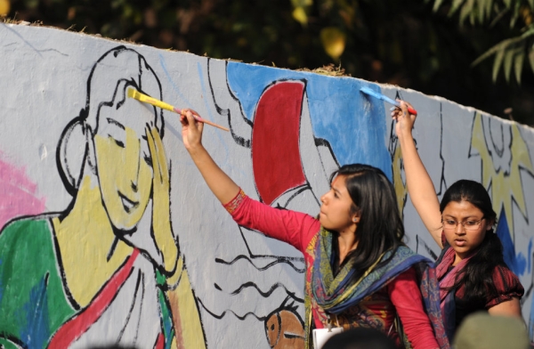 Bangladeshi fine arts students paint on a wall in front of the Shaheed Minar, the Language Movement memorial, in Dhaka on Febr. 20, 2012, as part of preparations for Language Martyrs Day and International Mother Language Day. 
(Munir Uz Zaman/AFP/Getty Images)