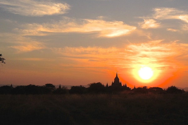 A setting sun casts an orange glow across the sky in Myanmar on January 28, 2014. (brentolson/Flickr)