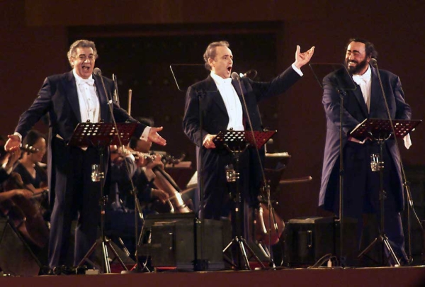 L to R: "Three Tenors" Placido Domingo, Jose Carreras, and Luciano Pavarotti, shown here at Beijing's Forbidden City on June 23, 2001, helped rekindle Chinese interest in Western opera in the decades following the Cultural Revolution. (Stephen Shaver/AFP/Getty Images)
