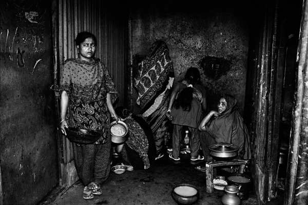 A kitchen with two burners, which 14 families rely on, in Gazipur, Bangladesh. (Gazi Nafis Ahmed)