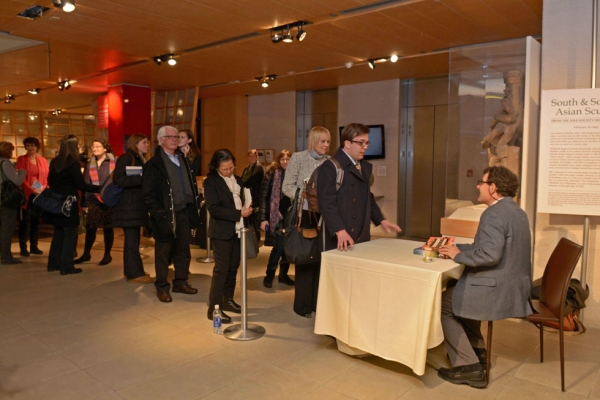 Nicholas Kristof signing copies of his books at Asia Society New York on February 26, 2015. (Elsa Ruiz/Asia Society)