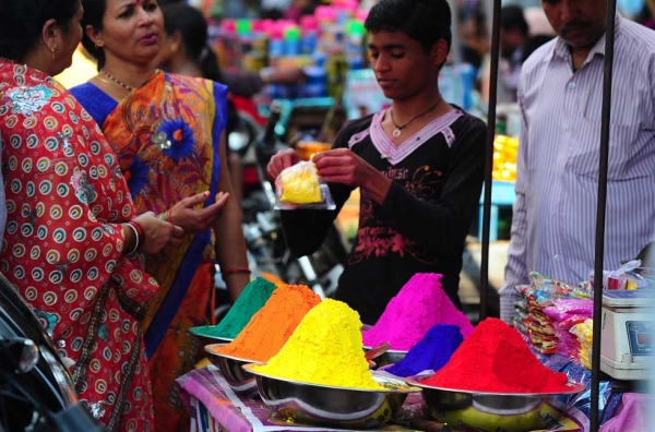 Women purchase colored powder for Holi celebrations at a roadside stall in the old city of Allahabad, India on March 4, 2015. Holi, the festival of colors, is an annual celebration of the coming of spring. During Holi celebrations, revelers spray colored powder and water on each other with great gusto. (Sanjay Kanojia/AFP/Getty Images)