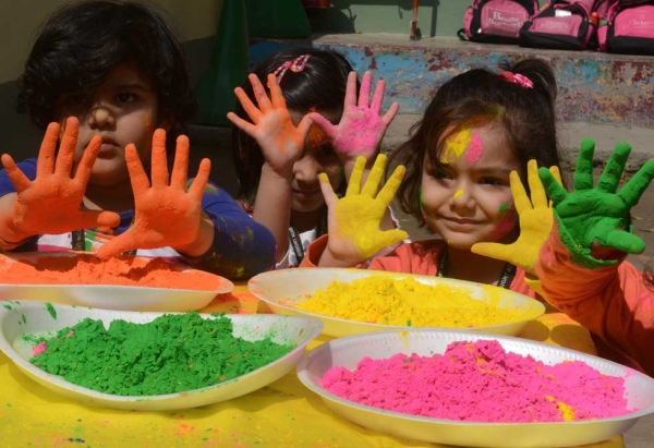 Children pose with color-stained hands during the Holi festival in Siliguri, India on March 4, 2015. (Diptendu Dutta/AFP/Getty Images)
