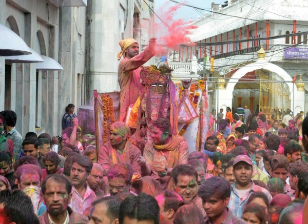 Devotees apply color and participate in a religious procession as they celebrate Holi at the Durgiayana Temple in Amritsar, India on March 5, 2015. (Narinder Nanu/AFP/Getty Images)