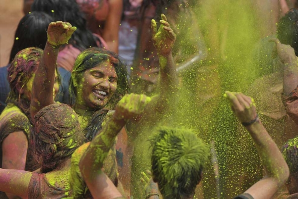 Revelers dance during Holi celebrations in Hyderabad, India on March 5, 2015. (Noah Seelam/AFP/Getty Images)