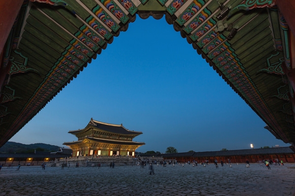 A pagoda inside Gyeongbok Palace lights up as night falls in Seoul, South Korea on May 10, 2015. (Brad Hammonds/Flickr)