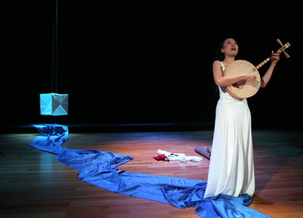 Jen Shyu in performance. (Tom Shea/TBS Photography)