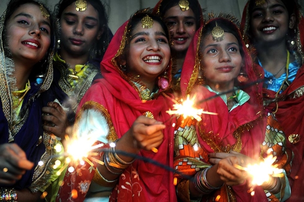 Indian schoolgirls play with sparklers at a function in Amritsar on October 16, 2009, on the eve of the Diwali festival. (Narinder Nanu/AFP/Getty Images)