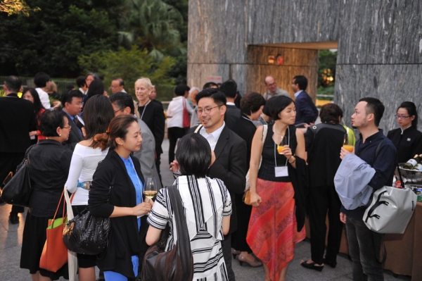Summit speakers and participants mingle at the cocktail reception on the roof of the Asia Society Hong Kong Center. (Elvis Ho)