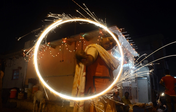 A Pakistani Hindu reveler waves sparklers on Diwali in Karachi on November 13, 2012. (Asif Hassan/AFP/Getty Images)