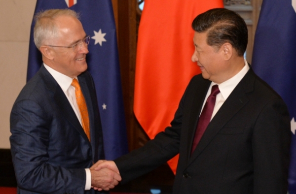 Chinese President Xi Jinping (R) shakes hands with Australian Prime Minister Malcolm Turnbull before their meeting at the Diaoyutai State Guesthouse in Beijing on April 15, 2016. (Kenzaburo Fukuhama/AFP/Getty Images)