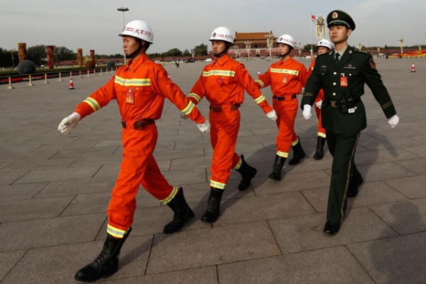 Chinese paramilitary policemen parade in front of Tiananmen Square on Nov. 7, 2012 in Beijing. The 18th National Congress of the Communist Party of China (CPC) convenes in Beijing on Nov. 8. (Lintao Zhang/Getty Images)