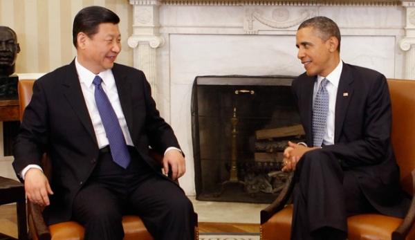 U.S. President Barack Obama (R) and then-Chinese-Vice-President Xi Jinping pose for photographs before meeting in the Oval Office at the White House February 14, 2012 in Washington, DC. (Chip Somodevilla/Getty Images)