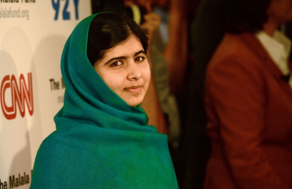 Pakistani student Malala Yousafzai poses for photographers before a panel discussion in New York City on Oct. 10, 2013, the same day she was awarded the European Parliament's prestigious Sakharov human rights prize. (Emmanuel Dunand/AFP/Getty Images) 