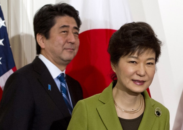 Japanese Prime Minister Shinzo Abe (L) and South Korean President Park Geun-hye arrive for a trilateral meeting with the U.S. president in The Hague on March 25, 2014. (Saul Loeb/AFP/Getty Images)