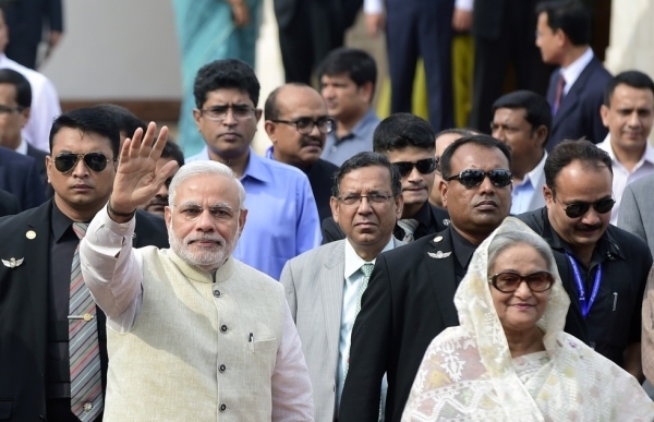 Indian Prime Minister Narendra Modi (L) gestures as Bangladeshi Prime Minister Sheikh Hasina looks on as he arrives at the Prime Minister's Office in Dhaka on June 6, 2015. (Munir Uz Zaman/Getty Images)