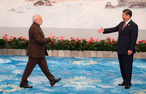 Chinese President Xi Jinping (R) welcomes Indian Prime Minister Narendra Modi for a banquet dinner during the BRICS Summit in Xiamen, Fujian province on September 4, 2017. (Fred Dufour/AFP/Getty Images)