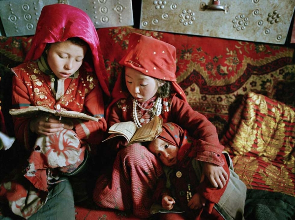 Three young Kyrgyz girls learn to read the Koran on a winter morning at Tshar Tash camp, near the source of the Amu Darya river, in the remote Pamir plateau of northeastern Afghanistan. (Matthieu Paley)