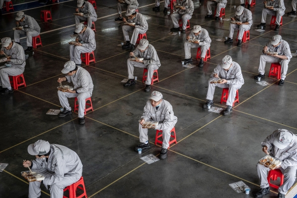 Factory workers in Wuhan, China, return to work