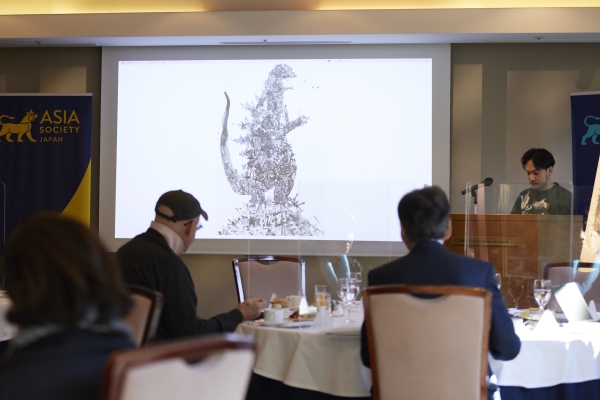 Nishigaki showing his work of Godzilla-themed work
