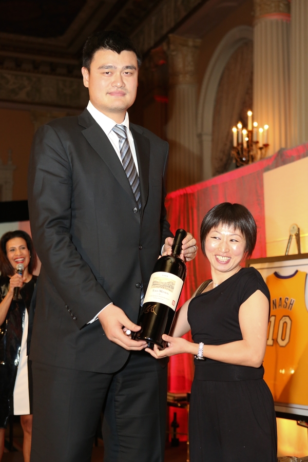 From left, Yao Ming, honored as "Visionary of the Year" and Shipping Xu, General Counsel DeWind, the winning bider for an autographed bottle of Yao Family Wine pose during the Asia Society Southern California 2013 Annual Gala held at the Millennium Biltmore Hotel on Tuesday, February 19, 2013 in Los Angeles, Calif. (Photo by Ryan Miller/Capture Imaging)