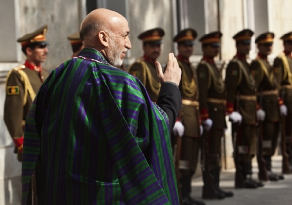 AFGHANISTAN, NOVEMBER 2 - President Hamid Karzai and an honour guard await UN Secretary General Ban Ki-moon at the Presidential Palace in Kabul. Ban flew into Kabul on November 2 for talks on the Afghan election crisis that ultimately left Karzai in power. (Ahmad Masood/AFP/Getty Images)