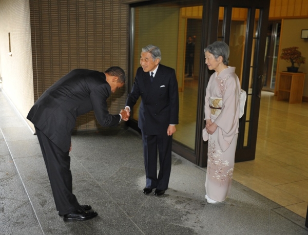 JAPAN, NOVEMBER 14 - US President Barack Obama (L) bows as he shakes hands with Japanese Emperor Akihito (C) and Empress Michiko (R) looks on at the Imperial Palace in Tokyo. Billing himself America&apos;s first &quot;Pacific president,&quot;Obama promised a full US role in charting Asia&apos;s future. (Mandel Ngan/AFP/Getty Images)