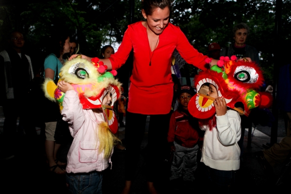 Asia Society's Brittany Millman with two "young lions." (Suzanna Finley/Asia Society)