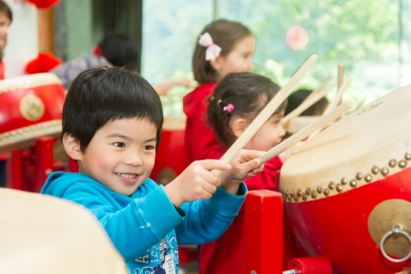 The little boy thumped enthusiastically during the workshop held after the Traditional Chinese Drum Performance.