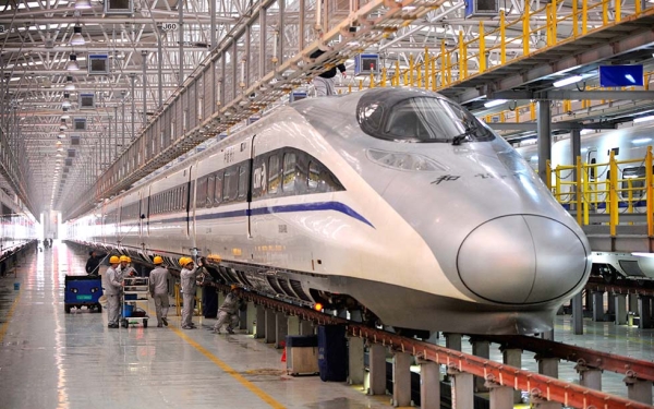 Mechanics perform a check on a high-speed train as railways across China prepare for the holiday rush on January 7, 2014 in Xi'an, China. (ChinaFotoPress/Getty Images)