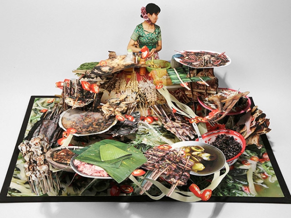 This spread from visual artist Colette Fu's new pop-up book "We Are Tiger Dragon People" depicts the cuisine of the Dai community. (Colette Fu)