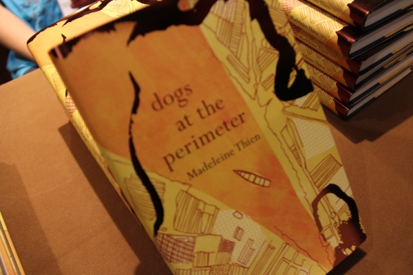 Copies of "Dogs at the Perimeter" by Madeleine Thien. (Asia Society Hong Kong)
