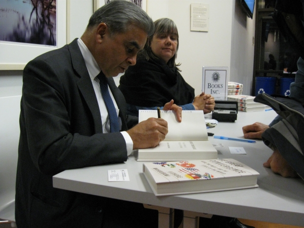 Mahbubani signed books at the event. 