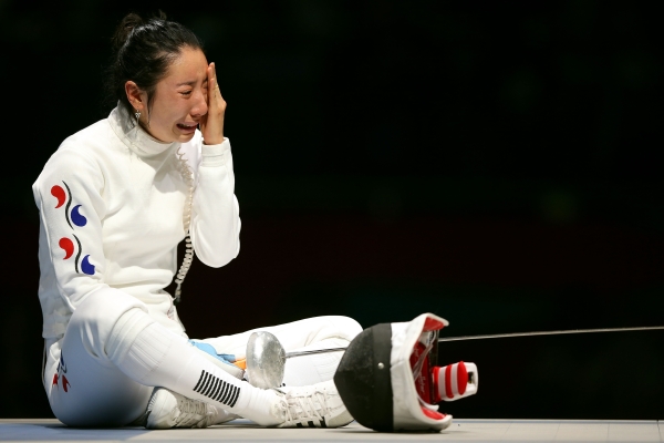 A Lam Shin of Korea cries after losing to Britta Heidemann of Germany in the Women's Epee Individual Fencing Semifinals on July 30, 2012. (Hannah Johnston/Getty Images)