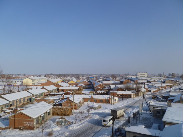 The village in winter, as seen from the new high-speed rail overpass. (Michael Meyer)