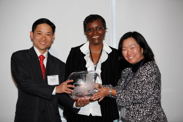 L to R: Allan Castro and Millicent Small-Williams of Colgate-Palmolive Company receiving the Award for Best Company for Asian Pacific Americans to Develop Workforce Skills from Linda Akutagawa