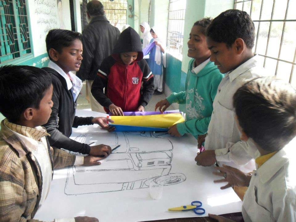 Students in the same workshop brainstorming design ideas for their Peace Rickshaw. (Pakistan Youth Alliance)