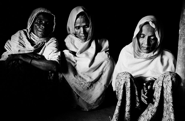 Beatings, extortion and the seizure of their homes in Myanmar forced these Rohingya women and 120 families from their village to flee to Bangladesh in early 2009. (Greg Constantine)