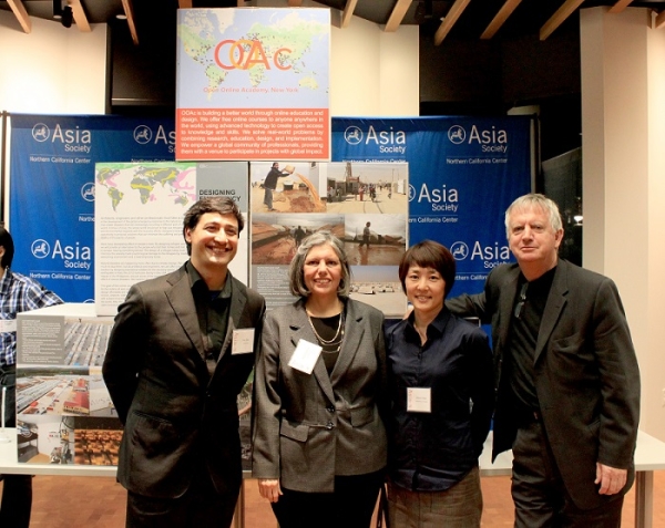 Panel Speakers: Illac Diaz, Mary Comerio, Hiromi Tabei, and Patrick Condon stand in front of the Open Online Academy's exhibit.