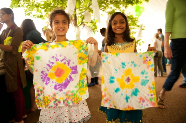 Two young festival-goers wave their newly-dyed shibori cloths (Jeff Fantich).