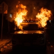Flames engulf a New York Police Department (NYPD) vehicle in Flatbush, Brooklyn, on May 30, 2020.