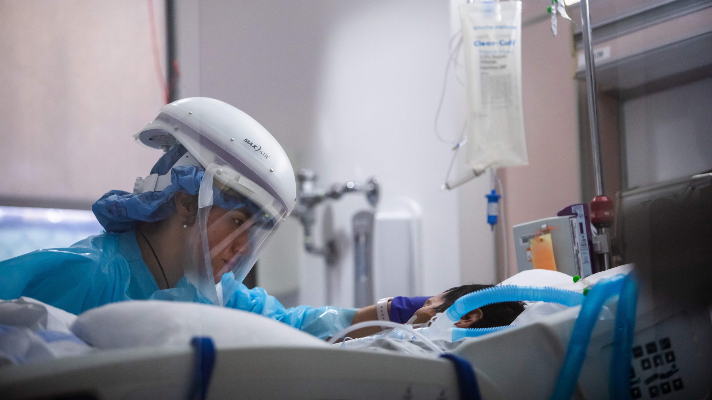 Registered nurse Yeni Sandoval wears personal protective equipment while she cares for a COVID-19 patient in the Intensive Care Unit at Providence Cedars-Sinai Tarzana Medical Center in Tarzana, California, on January 3, 2021.