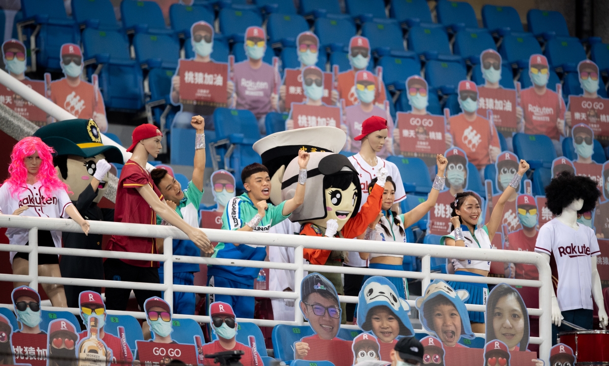 Taiwanese baseball fans attend a game alongside cardboard cutouts during the first months of the COVID-19 pandemic