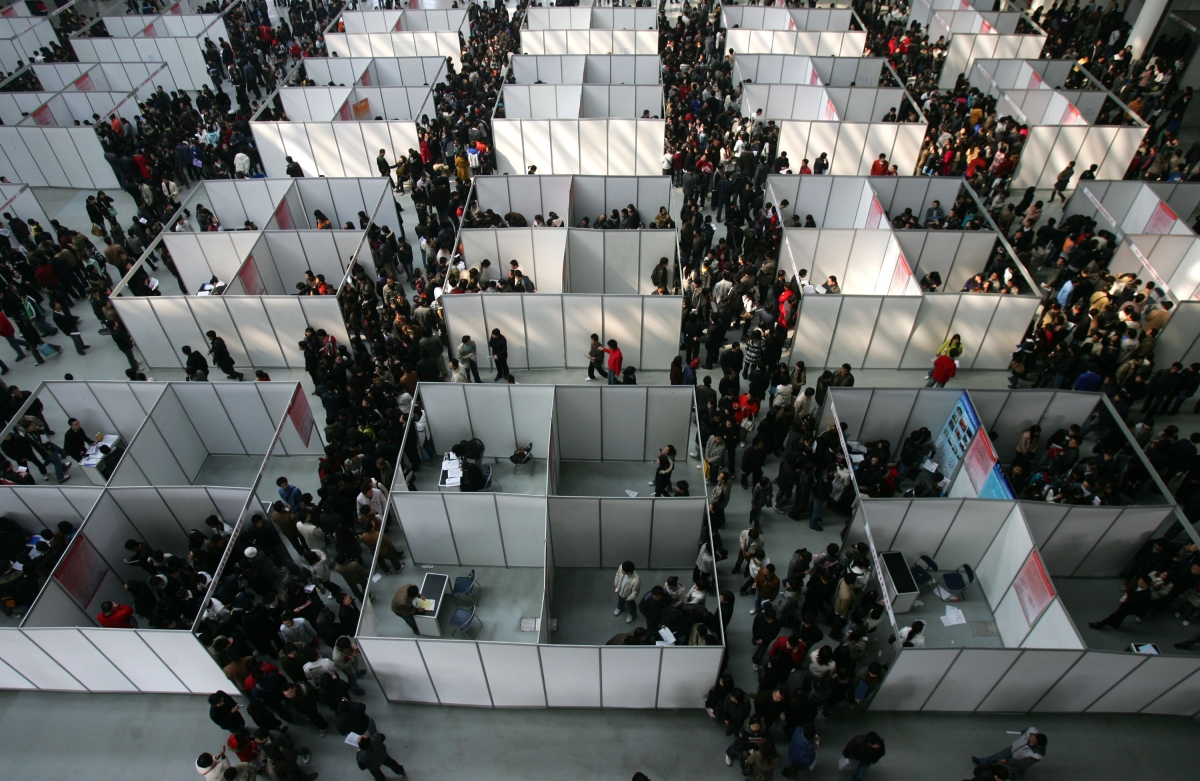 Job seekers visit a job fair for graduating university students at the Qujiang International Convention and Exhibition Center on February 28, 2009 in Xian of Shaanxi Province, China.